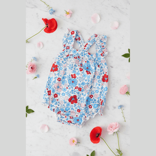Flat lay on marble with flowers