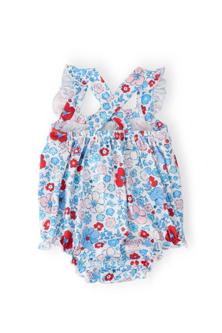 Floral-patterned baby romper with red and blue flowers 