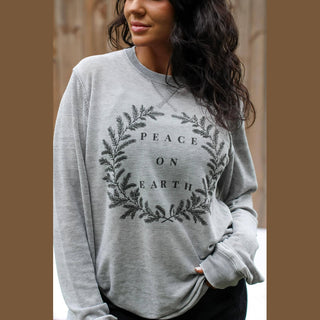 Light gray acid wash waffle knit long sleeve top with Peace on Earth botanical wreath graphic