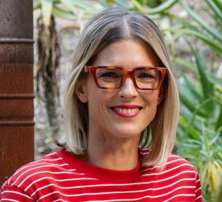 Peepers Curtsy reading glasses in blonde tortoise worn by woman with red lipstick