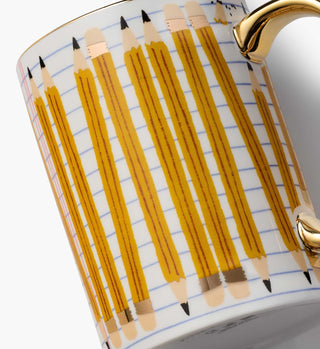 Close-up detail of Rifle Paper Co. porcelain mug with pencil pattern and gold handle