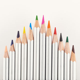Row of silver colored pencils with colored tips
