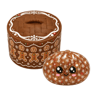 Brown glitter Christmas dumpling squishy toy with kawaii face and snowflake pattern