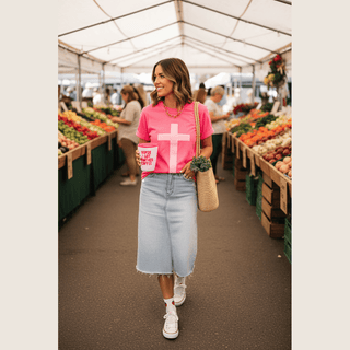 Pink Cross Puff Tee tucked into midi skirt with sneakers at farmers market