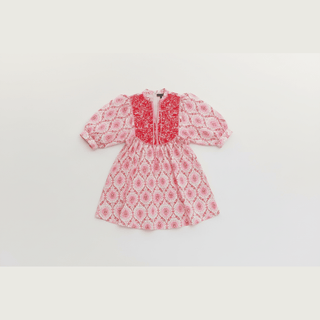 White and pink floral A-line mini dress flat lay with embroidered yoke and front zipper