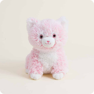 Pink and white fluffy kitten Warmies plush toy sitting upright on neutral background