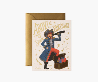Rifle Paper Co. pirate birthday card with gold envelope featuring illustrated captain and treasure chest