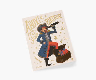 Rifle Paper Co. pirate birthday card featuring illustrated captain with telescope and treasure chest full of gifts