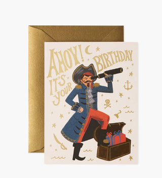 Rifle Paper Co. pirate birthday card with gold envelope featuring illustrated captain and treasure chest