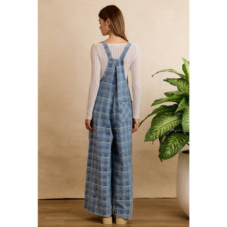 BiBi wide-leg plaid denim overalls in blue, worn over a white ribbed long-sleeve top