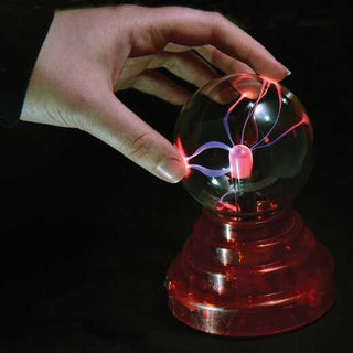 Red plasma light ball with glowing purple arcs, hand touching glass sphere