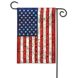 Flat-lay Studio M Pledge of Allegiance garden flag with ornate black metal stake and weathered finish