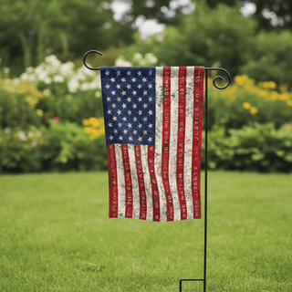 Pledge of Allegiance garden flag on black stake in green lawn with vintage distressed stars and stripes