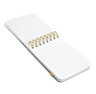 Small white spiral-bound pocket notebook with gold coil binding, lined pages