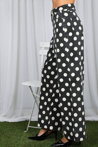 Vine & Love wide-leg black denim pants with large white polka dot print
