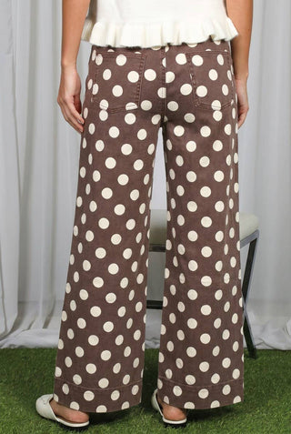 Vine & Love wide-leg brown denim pants with large cream polka dots, back view