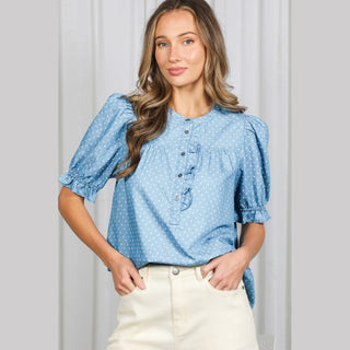 Light blue polka dot chambray shirt with puffed sleeves and ruffled front placket
