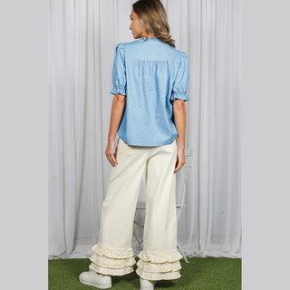 Back view of light blue polka dot chambray shirt showing gathered yoke detail