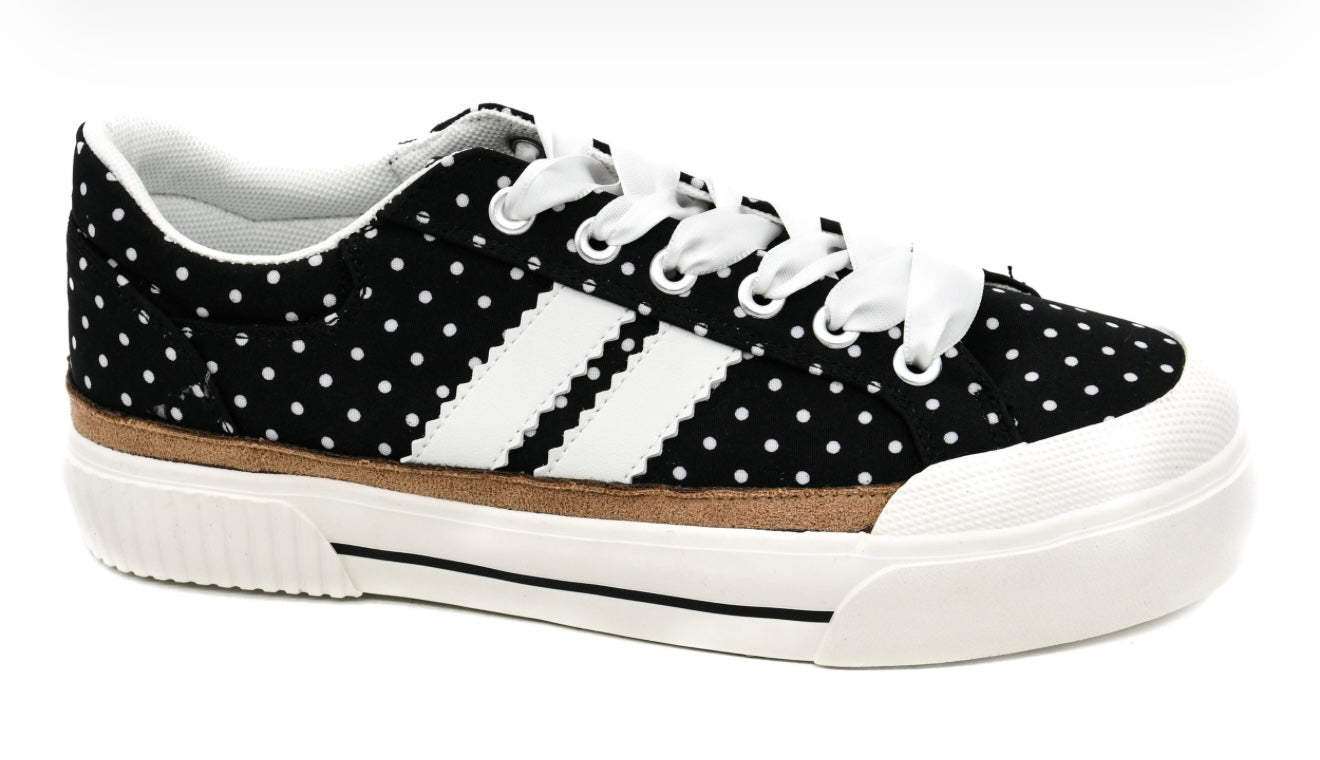 Black sneaker with white polka dots and stripes