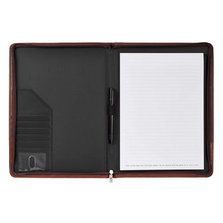 Open brown leather portfolio showing lined notepad, pen loop, card slots, and Bible verse