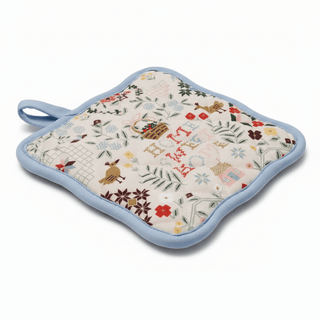 Home Sweet Home potholder shown at angle displaying quilted texture and binding