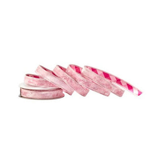 Pink velvet wired ribbon spool unrolled showing plaid reverse side in hot pink