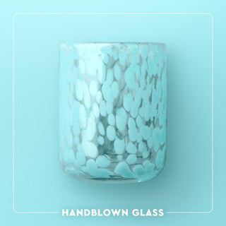 Handblown glass with a textured pattern on a light blue background