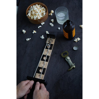 Putt Perfect golf putting game on dark surface with popcorn, beer bottle, and bottle opener