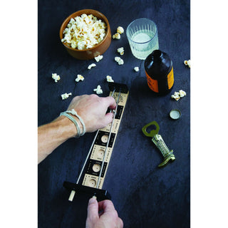 Person using Putt Perfect golf putting game board with popcorn and beer nearby
