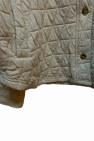 Beige quilted knit shacket with diamond stitching pattern and brown buttons