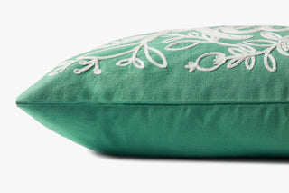Side profile of green linen pillow with white floral embroidery, 13x21 inches