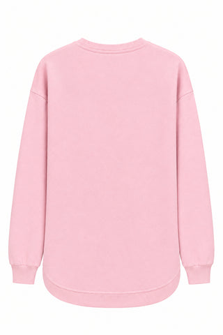 Pink crew neck sweatshirt back view with raw hem edge and long sleeves
