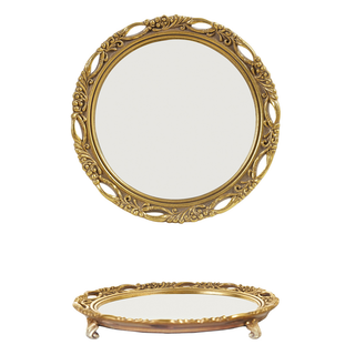Round resin mirrored footed tray in antique gold with ornate scrollwork frame, shown from front and side angles