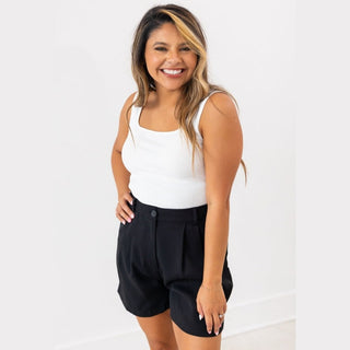 White rib knit tank top with square neckline and mom crop cut on model side pose