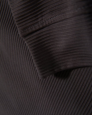 Close-up detail of ribbed ottoman knit texture on black quarter-zip mock neck top