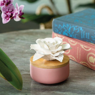 Candle Warmers porcelain white rosette aroma diffuser on pink ceramic jar with wood lid