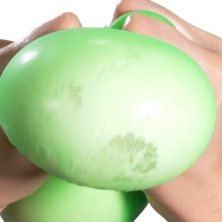 Hands stretching a green Super Nee Doh stress ball showing its flexibility