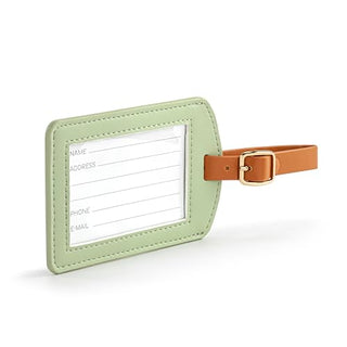 Sage green leather luggage tag with tan strap, gold buckle, and clear ID window