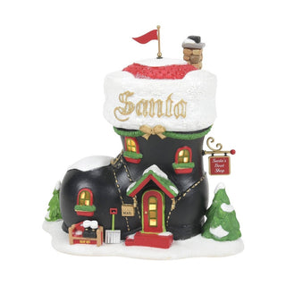 Department 56 Santa's Boot Shop Christmas village piece with snow-covered black boot building