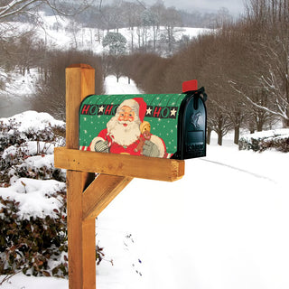 Green Santa Claus Ho Ho Ho Christmas magnetic mailbox cover on snowy post