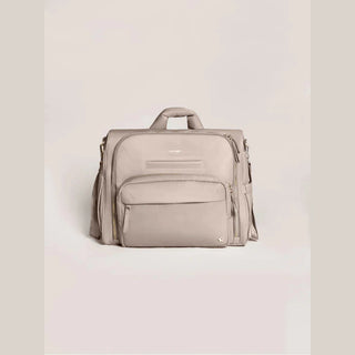 Front taupe JuJuBe Satchel backpack with embossed logo, star accent, and multiple zippered pockets