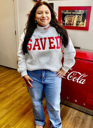 Gray mock neck sweatshirt with bold red SAVED By Grace lettering on chest