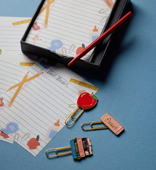Rifle Paper Co. Schoolhouse Note Writing Set with enamel paper clips, red pen, and school-themed stationery
