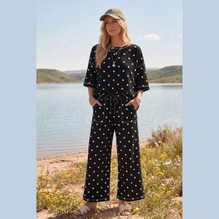 Black scuba polka dot matching set with drawstring waist pants and white contrast stitching at lakeshore