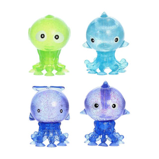 Aurora Sealife Suction Squeezy blind assortment featuring lime green octopus, blue dolphin, purple sea creature, and royal blue octopus with glittery translucent silicone texture