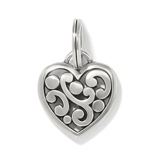 Silver-plated Brighton heart charm featuring symmetrical engraved scrollwork and dual-loop bail detail