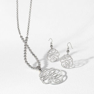 Brighton Skribbel French Wire Earrings in silver with matching necklace set on white background