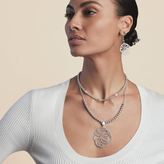Model wearing Brighton Skribbel French Wire Earrings in silver with matching necklace set