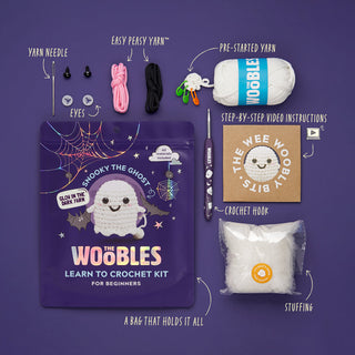 The Woobles Snooky the Ghost learn to crochet kit contents spread on purple background