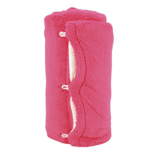 Hot pink plush sherpa snowthrow blanket rolled and secured with ribbon ties, white interior visible